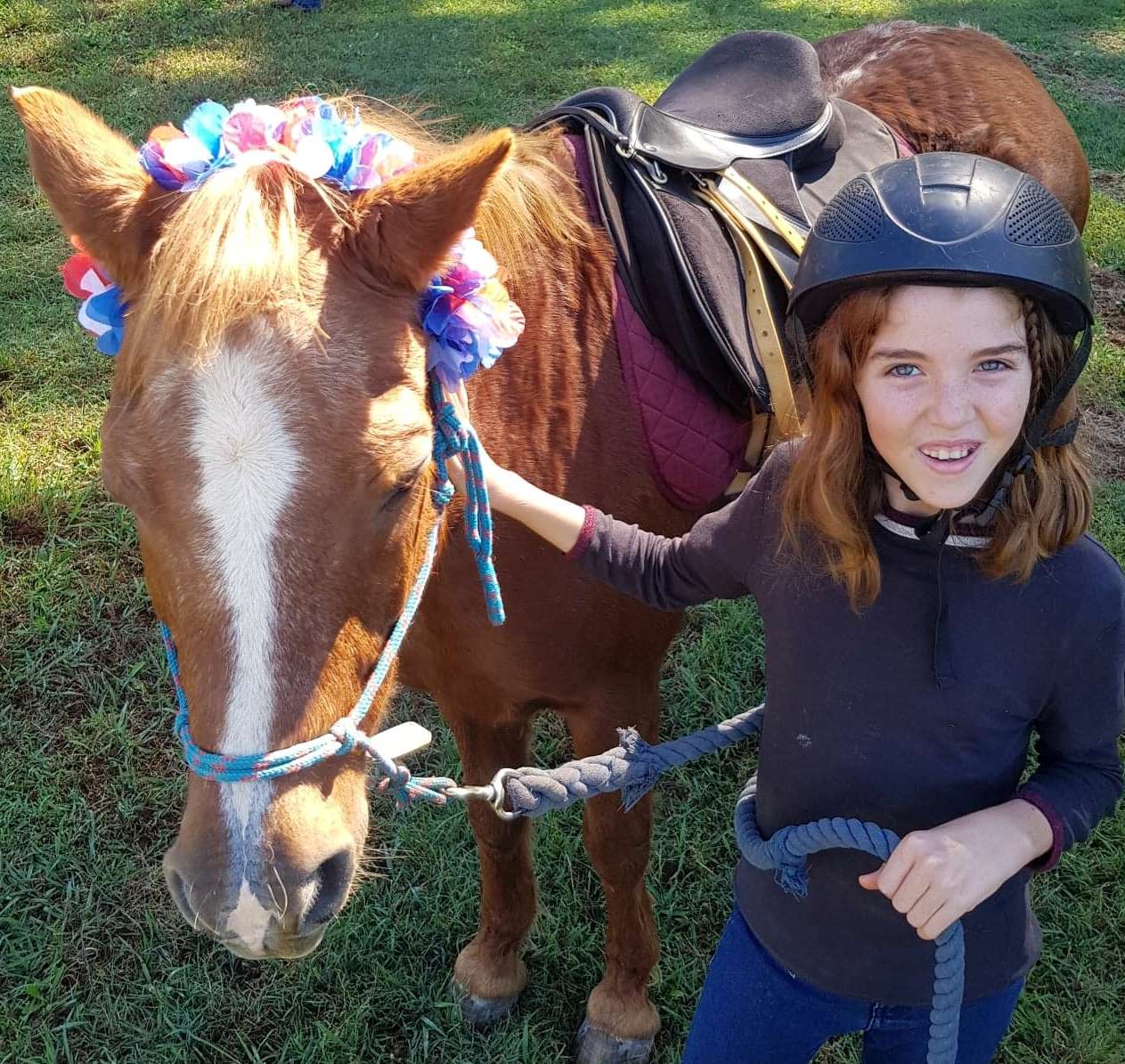 Young disabled girl learning to train horse